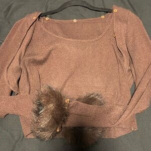 A two piece long sleeve and skirt brown